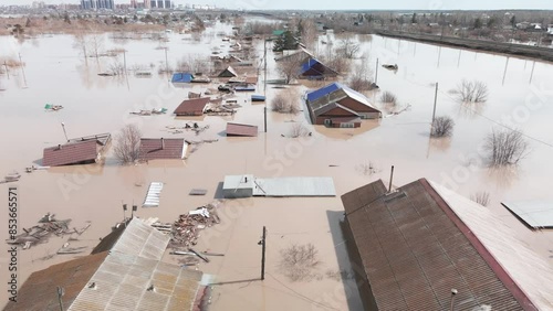 Flood. Damaged houses in the flood. The houses were washed away by the current of the water. A city destroyed by a flood. A natural disaster, an emergency. An environmental disaster. Damage, trouble.