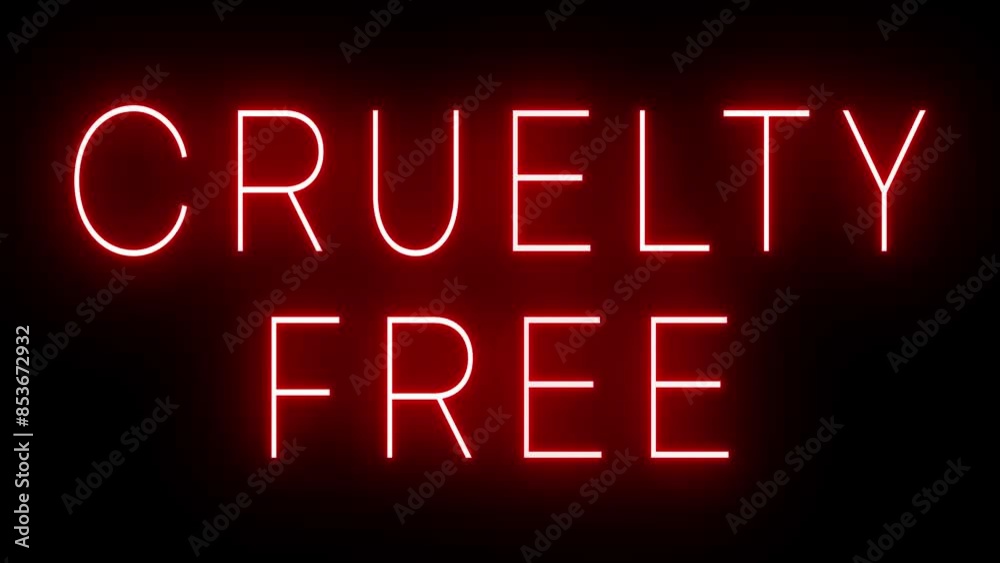 Flickering red retro style neon sign glowing against a black background for CRUELTY FREE