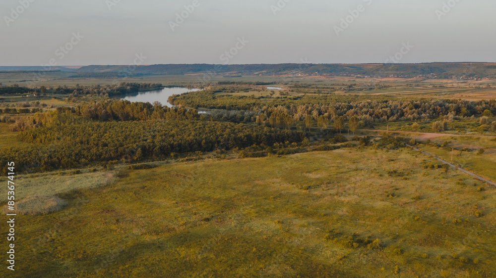 Fototapeta premium Tranquil Scenery of a Rural Landscape with lake in the distance