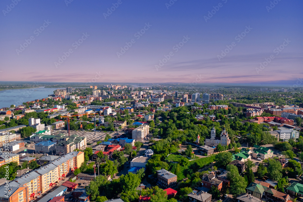 Fototapeta premium Summer panorama city Tomsk and Tom River with sunlight. Aerial top view from drone