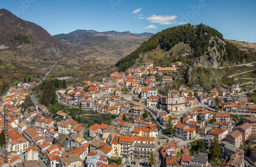 Aerial View of the old town and castle of Castel di Sangro on a sunny day - mountain italian village in the heart of Alto Sangro, Roccaraso ski area - Italian Appennine, L'Aquila, Abruzzo, Italy photo