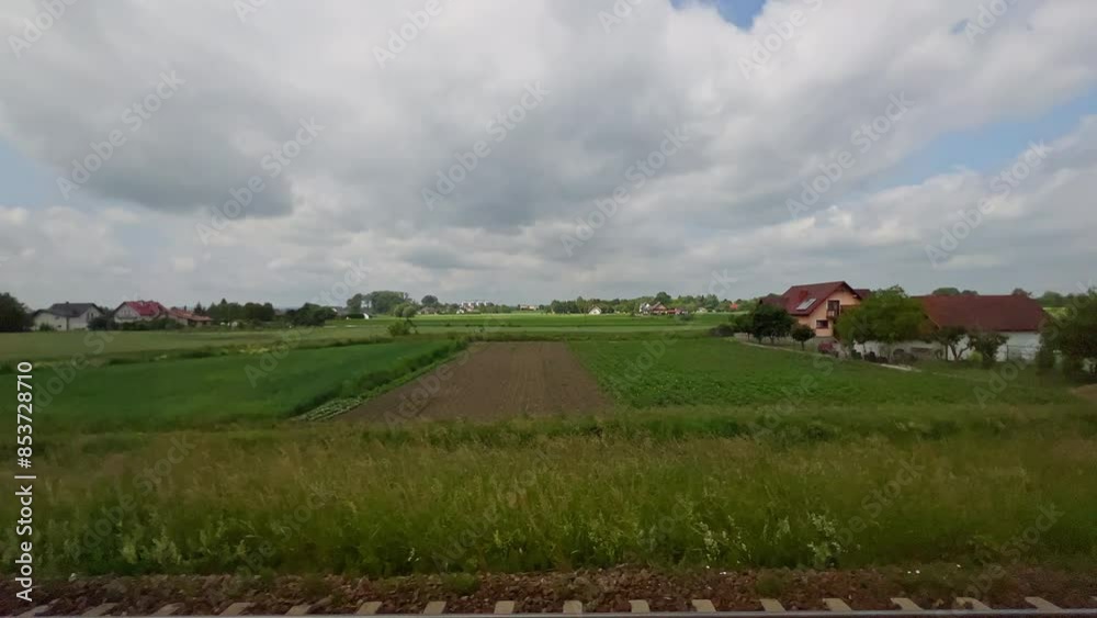 View from window of moving high-speed train on beautiful scenery with hills,field,forest,junction of railway tracks.Journey landscape on sunny day.4k footage. High quality 4k footage View from window of moving high-speed train on beautiful scenery with hills,field,forest,junction of railway tracks.Journey landscape on sunny day.4k footage. High quality 4k footage