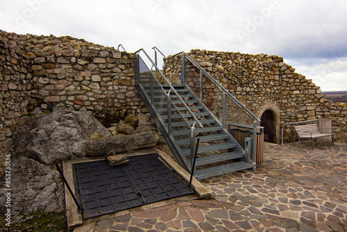 The stairs leading to the top of Acropolis of Devin castle (Slovak: Devinsky hrad). It is one of the oldest castles in Slovakia located at confluence of Danube River and Morava River near Bratislava photo