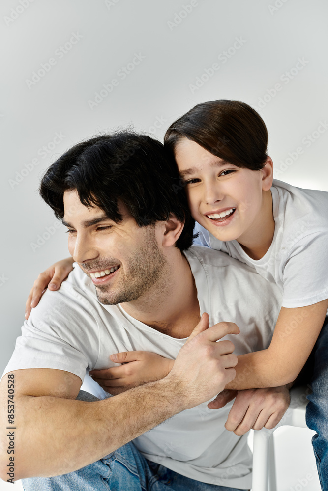 A father and his son share a moment of joy and affection.