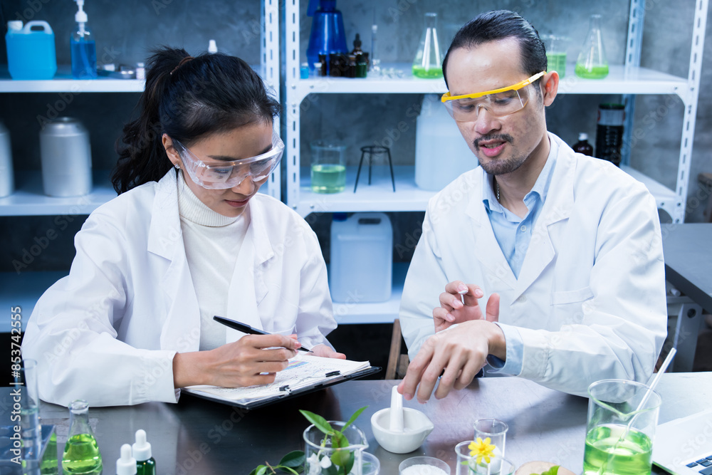 Scientists are recording the results of skin experiment with cosmetics medicine, Skin care, organic make-up, beauty treatment essential oil experiment or research and development containing natural. Scientists are recording the results of skin experiment with cosmetics medicine, Skin care, organic make-up, beauty treatment essential oil experiment or research and development containing natural.