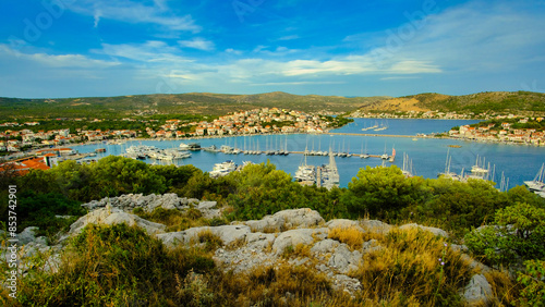 A beautiful view of a harbor with many boats and a clear blue sky