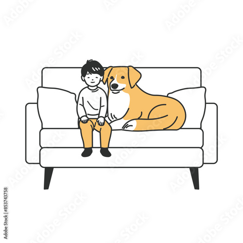 ソファに座る男の子とペットの犬