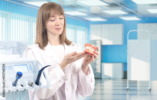 Woman dentist. Dental surge...