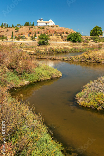 Marsh of Castro Marim and Vila Real de Santo António in Portugal, with the ravelin and the chapel of Santo António in the background, on a sunny day in summer. photo