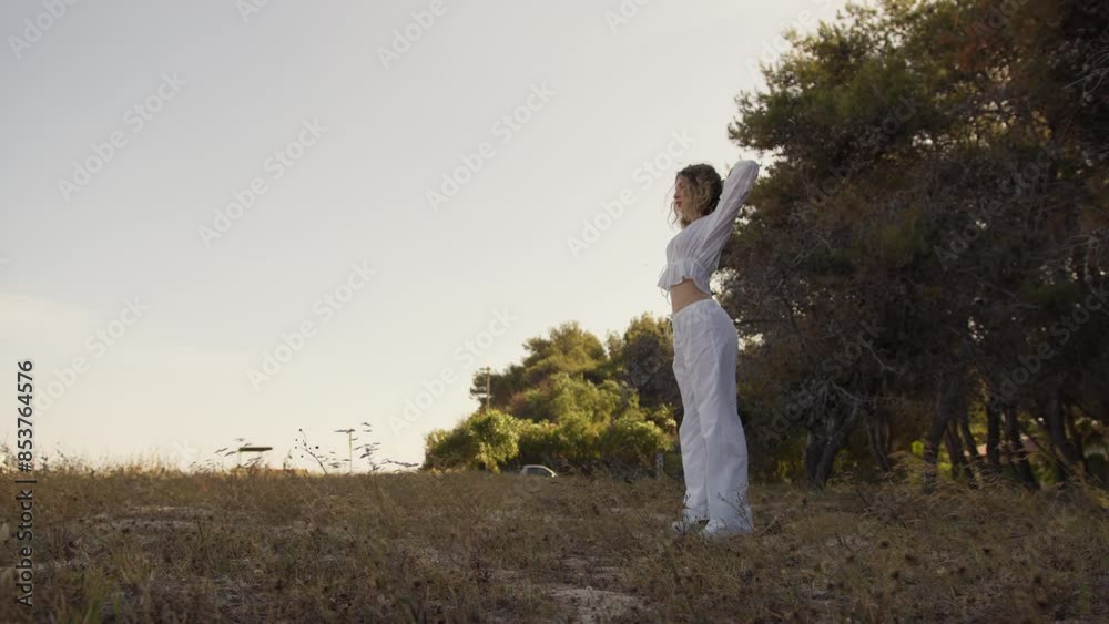 Young Woman Moves Arms For Warmup Before Training Young Woman Moves Arms For Warmup Before Training