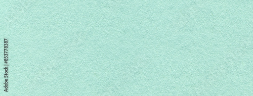 Texture of craft light cyan paper background colors, macro. Structure of vintage kraft blue cardboard.