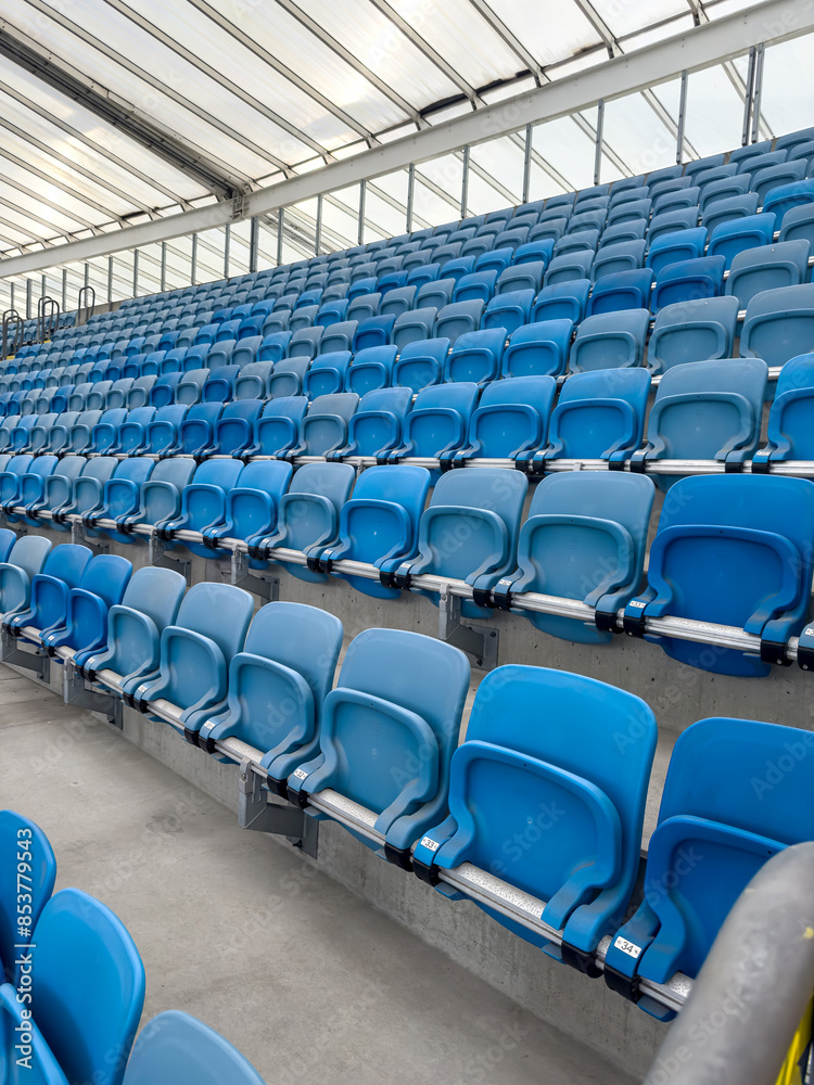 Fototapeta premium empty blue tribunes? seating rows in a stadium