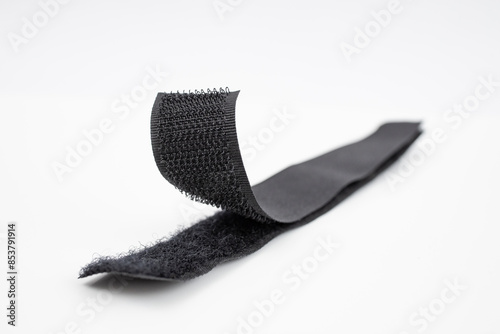 Fastener Velcro tape isolated on white, soft focus close up
