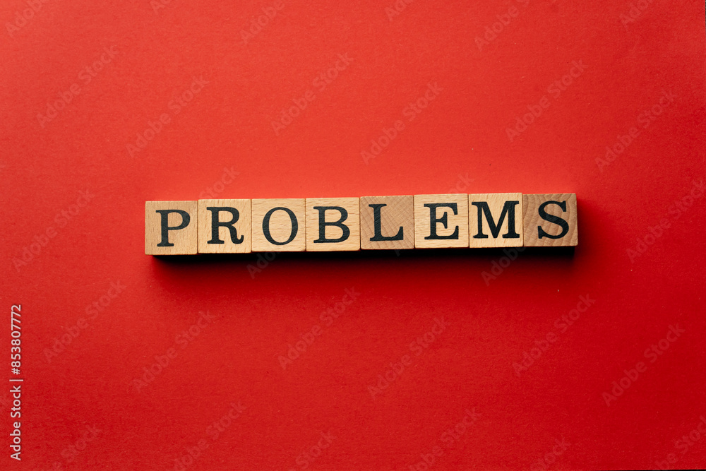 Obraz premium a yellow warm background without shadows wooden cubes with black letters laid out word problems