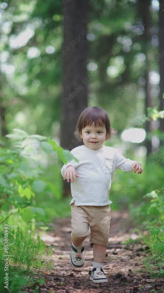 The toddler is running and playing in the forest, enjoying a carefree childhood. The child is running around in the green grass, living a summer lifestyle. The toddler is running and playing in the forest, enjoying a carefree childhood. The child is running around in the green grass, living a summer lifestyle.