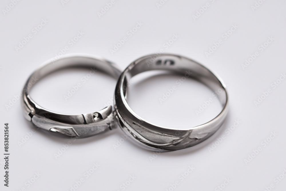 silver rings. Two decorative silver rings lie on a white table, close-up top view, costume jewelry concept silver rings. Two decorative silver rings lie on a white table, close-up top view, costume jewelry concept