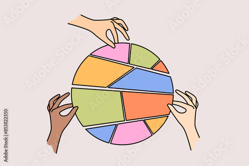 Hands of people with business diagram made from small pieces, and doing team work together with colleagues. Concept of dividing pie in form of diagram among everyone to get fair share for good job job