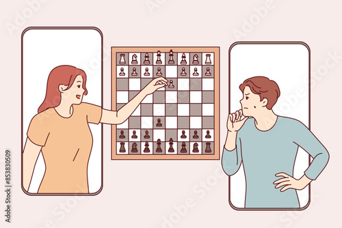 Chess game in mobile phone application between man and woman competing in intellectual game. Players play chess over internet, trying to checkmate opponent to prove mental superiority.