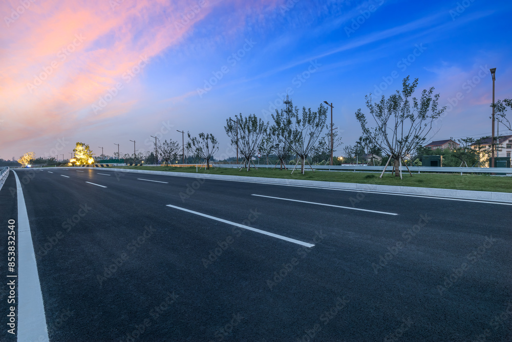 Fototapeta premium Countryside asphalt highway road and colorful sky clouds background