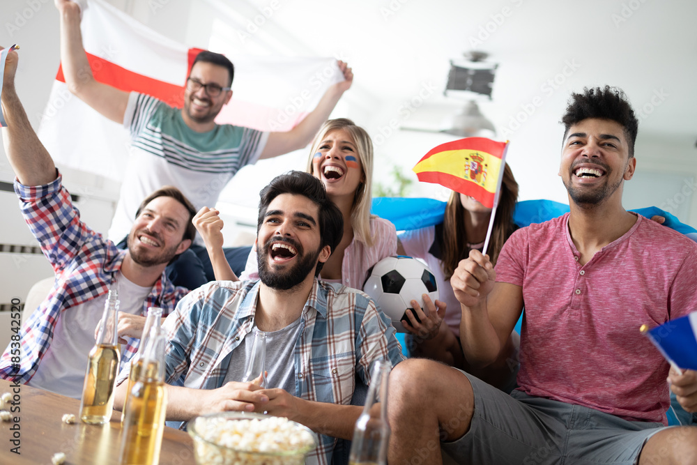 © NDABCREATIVITY - Group of multi-ethnic people celebrating football game © NDABCREATIVITY - Group of multi-ethnic people celebrating football game
