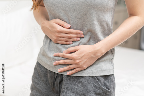 Flatulence ulcer, asian young woman, girl hands in belly, stomach pain from food poisoning, abdominal pain and digestive problem, gastritis or diarrhea. Abdomen inflammation, menstrual period people.