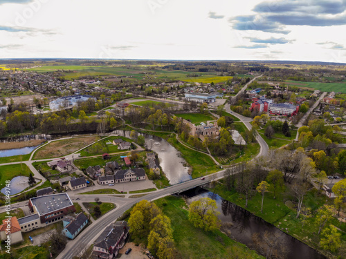 Bridge over Berze river and ancient medieval castle ruins Dobele Latvia, aerial drone view photo