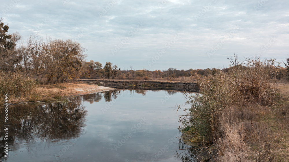 Siverskyi Donets river turn in Ukraine with autumn nature and cloudy sky reflections Siverskyi Donets river turn in Ukraine with autumn nature and cloudy sky reflections