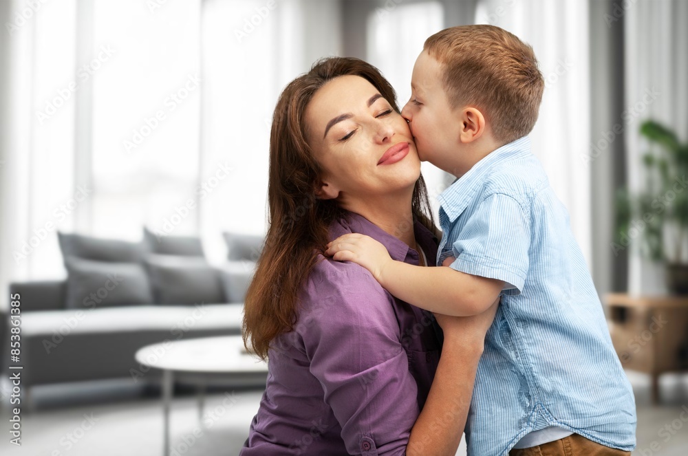 Happy young Woman And cute child Hugging Happy young Woman And cute child Hugging