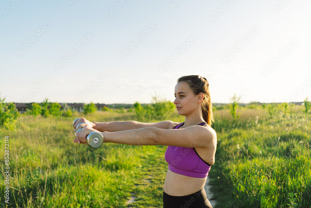 Beautiful girl doing fitness or yoga in nature on a sunny summer sunset. Body positive, sports for women, harmony, healthy lifestyle, self-love and wellness. Beautiful girl doing fitness or yoga in nature on a sunny summer sunset. Body positive, sports for women, harmony, healthy lifestyle, self-love and wellness.