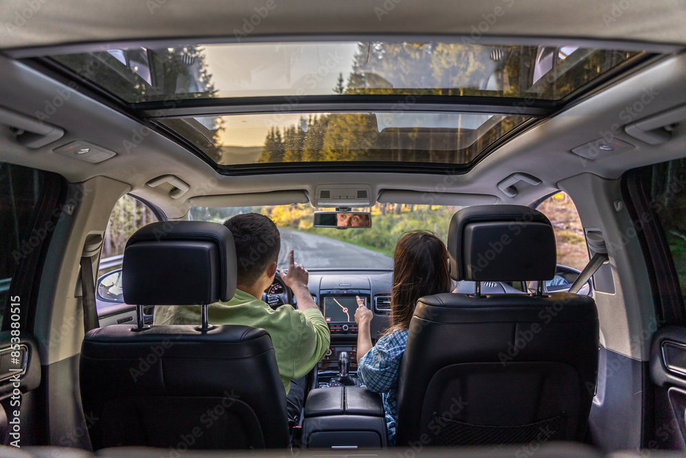 Man and woman traveling in car, sitting in car driving to travel destination. Man and woman traveling in car, sitting in car driving to travel destination.
