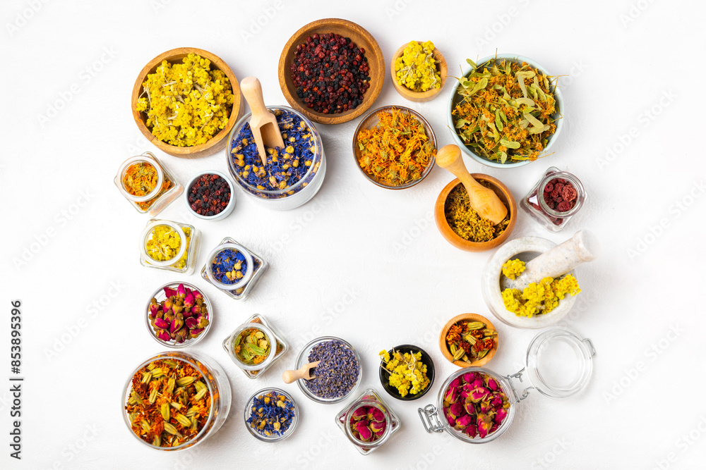Assortment of dry herbal and berry tea on a wooden background. Tea party concept. medicinal herbs. Healing herbs.Alternative medicine.Linden, calendula, cornflowers, marigold, tansy, tea rose. Assortment of dry herbal and berry tea on a wooden background. Tea party concept. medicinal herbs. Healing herbs.Alternative medicine.Linden, calendula, cornflowers, marigold, tansy, tea rose.