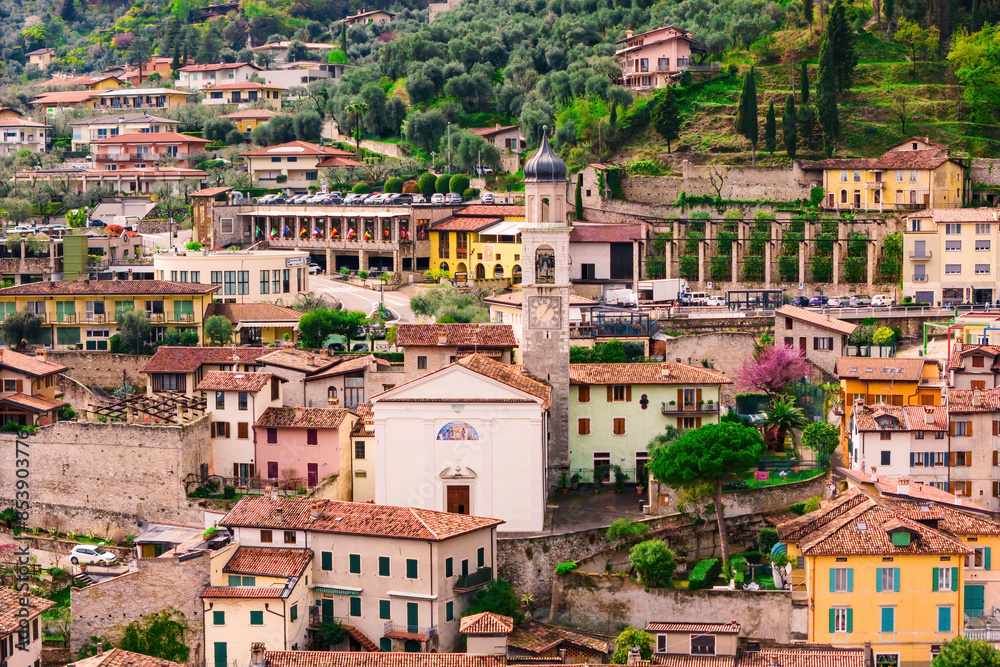 Historic buildings with church in Italian town of Limone on Lake Garda, Italy. Aerial view Historic buildings with church in Italian town of Limone on Lake Garda, Italy. Aerial view