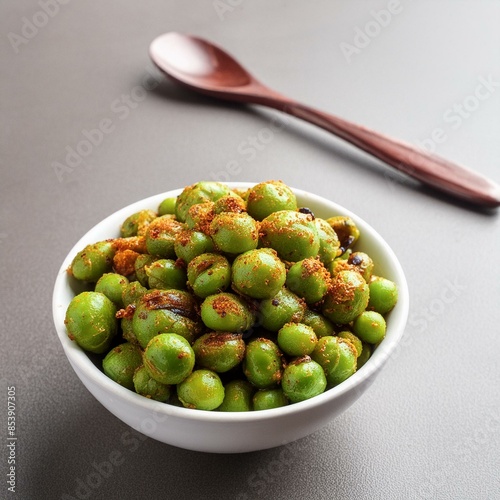 Indian namkeen snack food fried spicy green peas also called masala green peas, masala matar, hara matar, masala vatana or chatpata matar photo