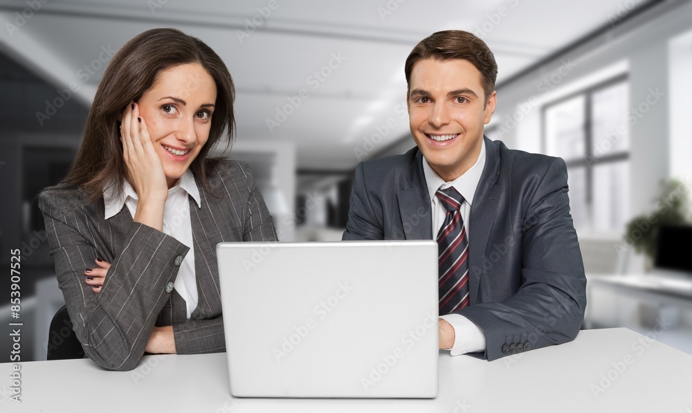 Smiling financial advisor consulting client at meeting Smiling financial advisor consulting client at meeting