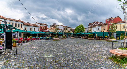 A panorama view across a square in Korca, Albania in summertime photo