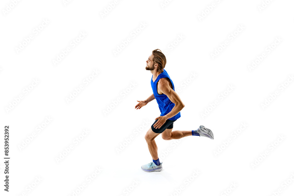 Athletic and determined man, runner in motion, training, growing speed for marathon isolated on white studio background. Concept of sport, marathon, competition, healthy and active lifestyle Athletic and determined man, runner in motion, training, growing speed for marathon isolated on white studio background. Concept of sport, marathon, competition, healthy and active lifestyle