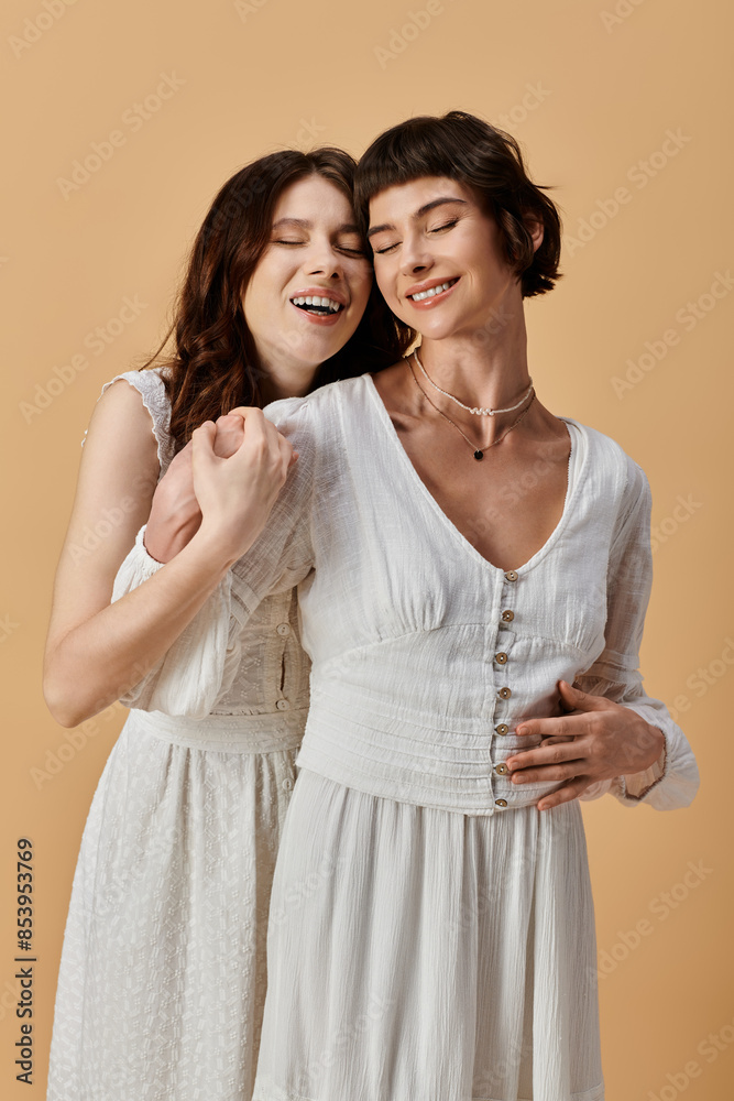 Two stylish young women in white summer dresses pose against a beige background, showcasing their love and fashion sense. Two stylish young women in white summer dresses pose against a beige background, showcasing their love and fashion sense.