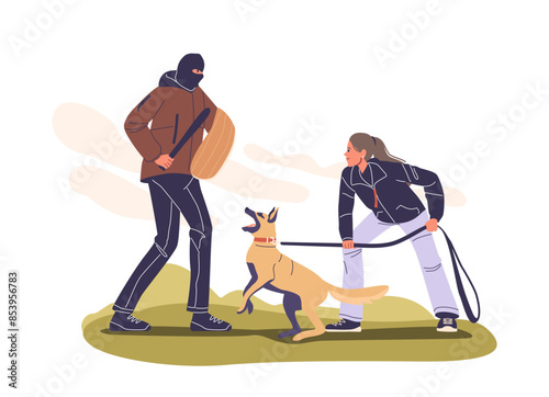 Woman Training A Guard Dog In A Yard With A Trainer In Protective Gear. The Dog Is Being Taught Protection Skills