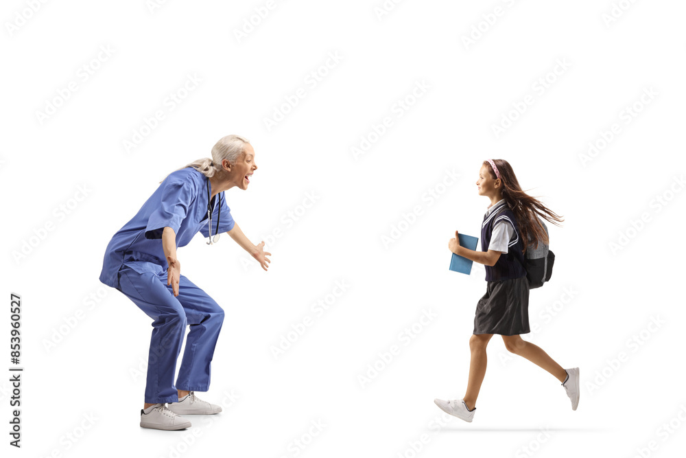 Profile shot of a happy female health care worker waiting to hug a schoolgirl Profile shot of a happy female health care worker waiting to hug a schoolgirl