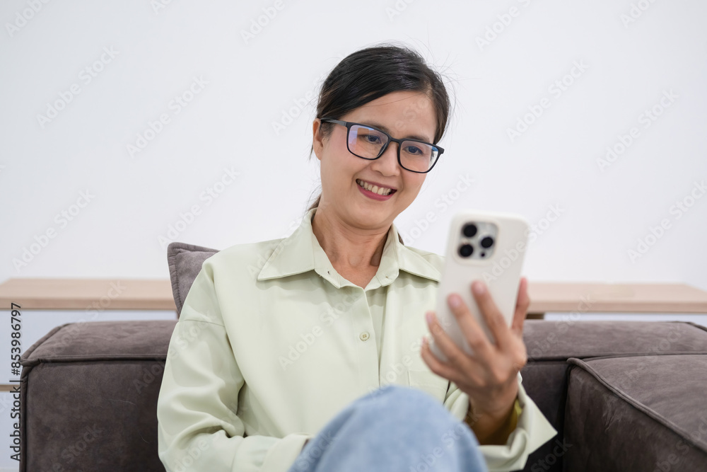 Woman embraces digital world from comfort of home. Woman embraces digital world from comfort of home.