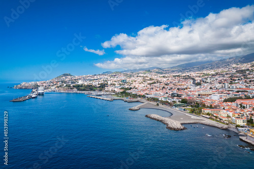 Funchal city on Madeira island on Atlantic ocean coast, Portugal island in ocean. Aerial view