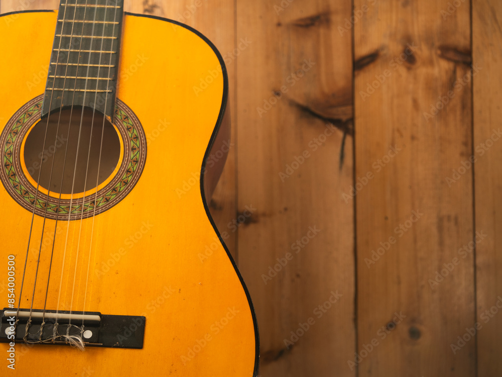 Obraz premium Classical guitar strings on wooden background