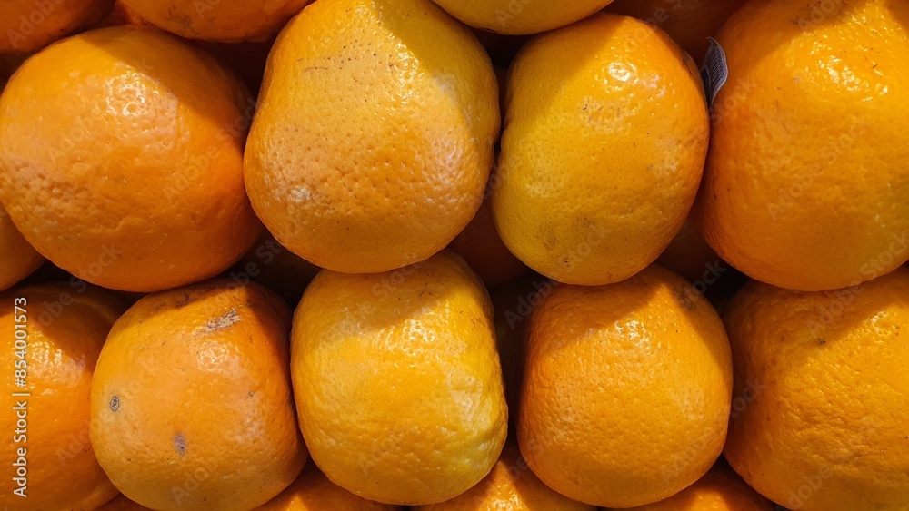 Close up pile of tasty fresh oranges sold at the market as a background. Close up pile of tasty fresh oranges sold at the market as a background.
