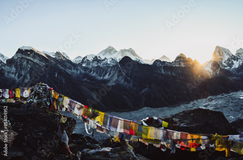 Amazing panorama from Gokyo Ri viewpoint to Mount Everest, Lho La, Nuptse, Lhotse peaks. Sagarmatha National Park, Nepal.Golden sunrise with clear blue sky and Mt Everest peak view photo