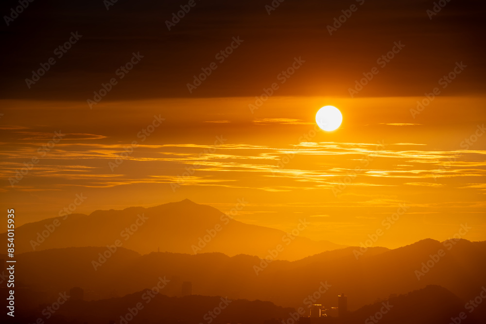 At dusk, the sun shuttles between clouds and is eventually blocked by clouds. Landscape of the dusk sky at Dajianshan. Xizhi District, New Taipei, Taiwan. At dusk, the sun shuttles between clouds and is eventually blocked by clouds. Landscape of the dusk sky at Dajianshan. Xizhi District, New Taipei, Taiwan.