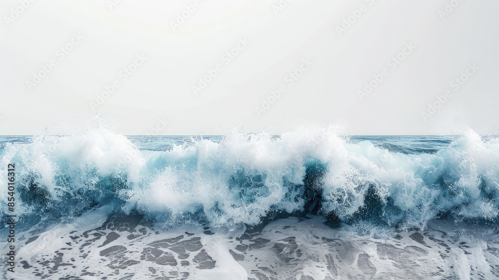 Blue ocean waves crashing on shore with foamy water under clear sky Blue ocean waves crashing on shore with foamy water under clear sky