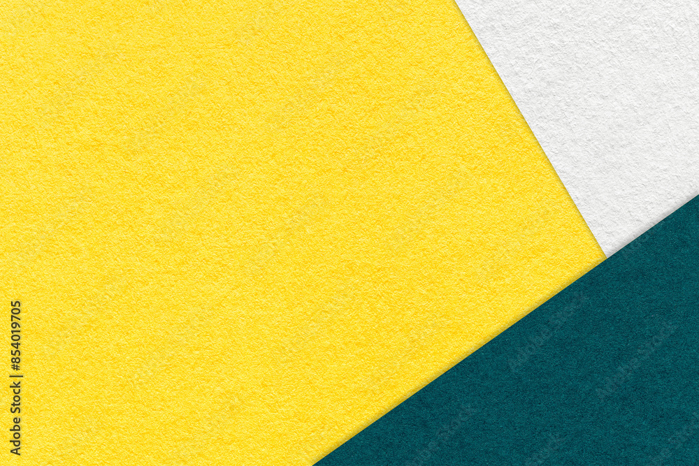 Texture of craft yellow color paper background with white and emerald border. Vintage abstract cardboard. Texture of craft yellow color paper background with white and emerald border. Vintage abstract cardboard.