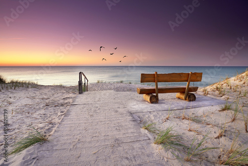 Fototapeta Naklejka Na Ścianę i Meble -  beautiful evening on the beach at sea in sunset
