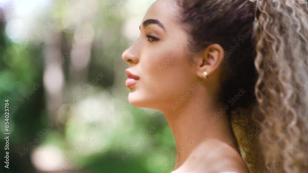 Young fitness woman walking in woodland. Teenager enjoying nature in contemplation Young fitness woman walking in woodland. Teenager enjoying nature in contemplation