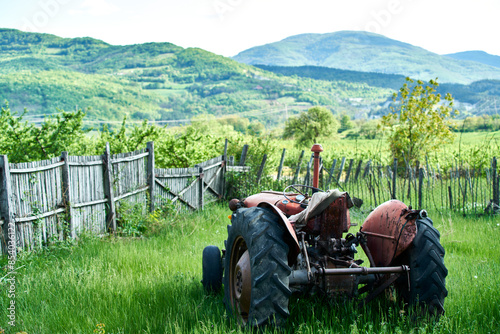 old tractor and mountain range background